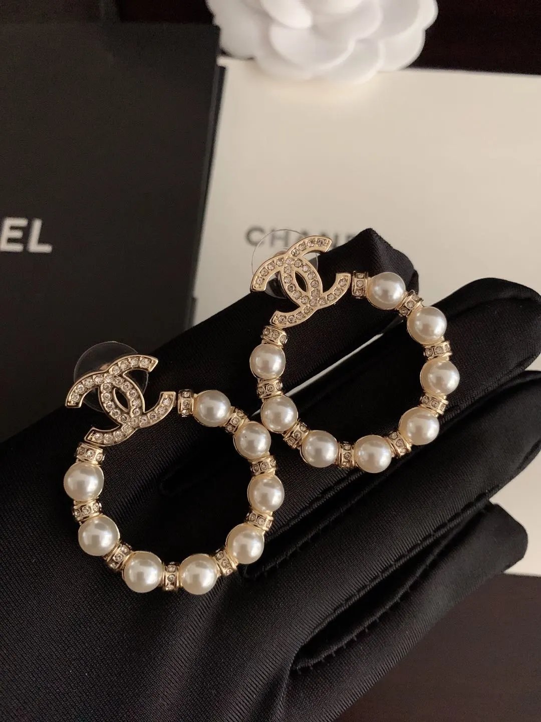 Ch*anel's latest pearl surround earrings